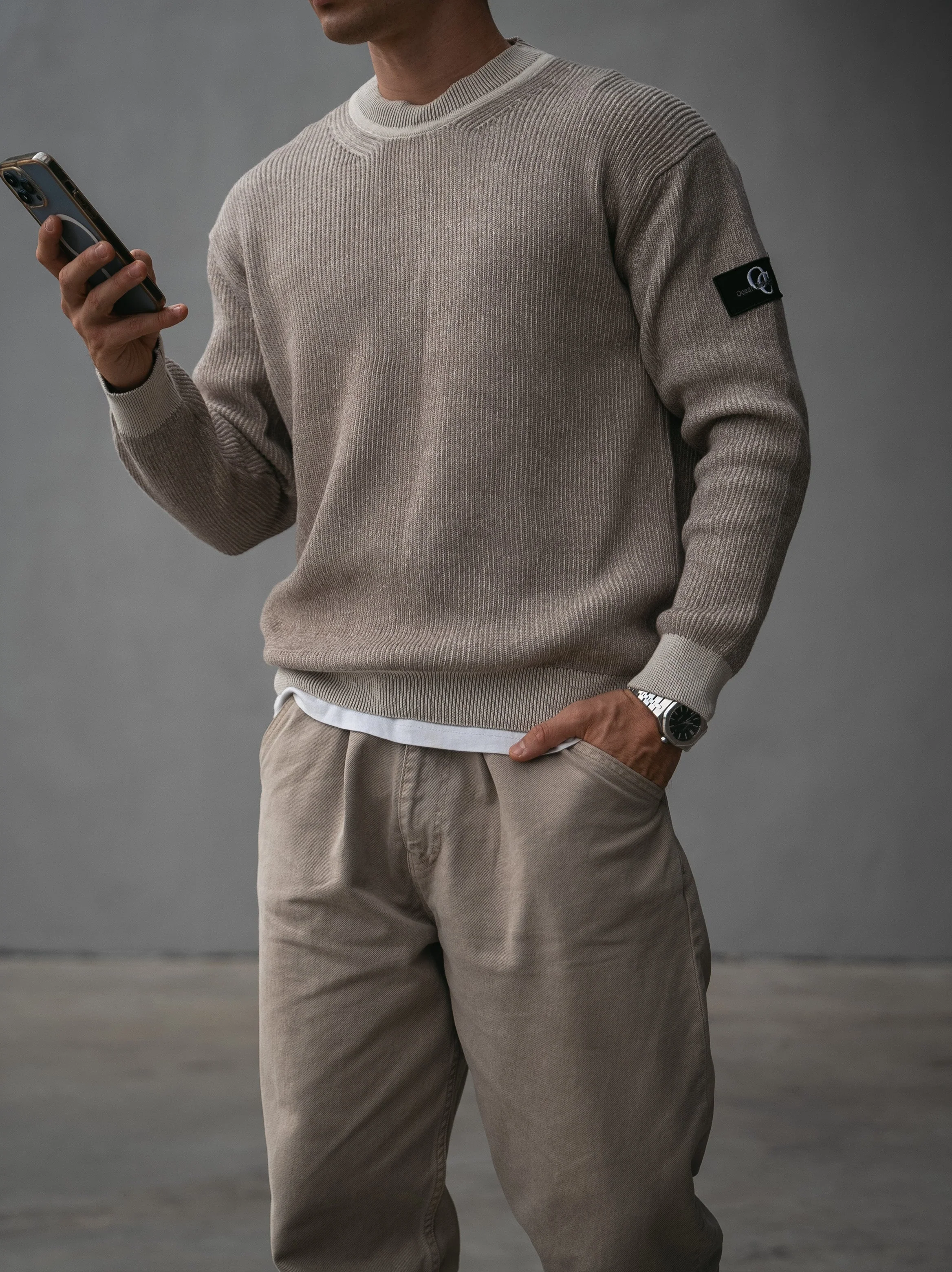 Knitted sweater with patch